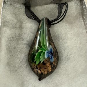 Blown Glass Pendant Necklace With Floral Design